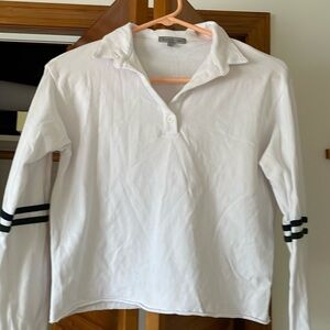 Long sleeve polo style top with blue and dark green accents on sleeves